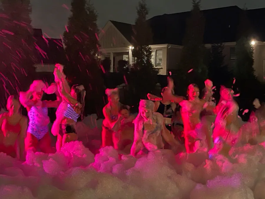 Pink Night Glow lighting at a birthday foam party
