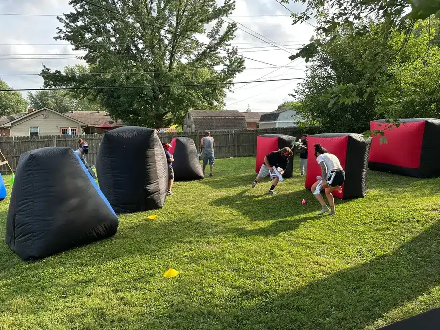 Players regrouping behind cover during a Gel Blaster battle