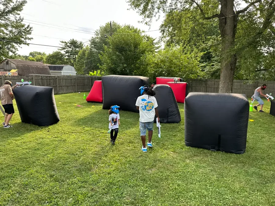 Kids moving between bunkers during a Gel Blaster mission