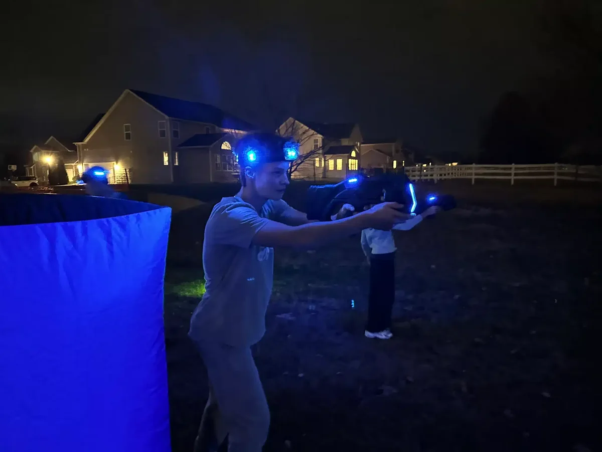 Nighttime laser tag fun with illuminated LED head sensors