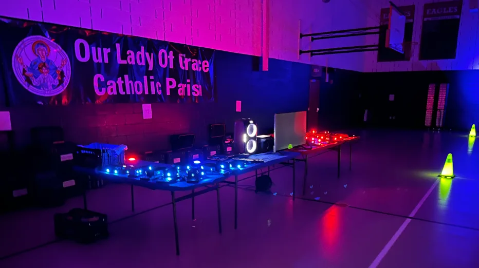 Glow laser tag equipment and lighting staged before a community parish event