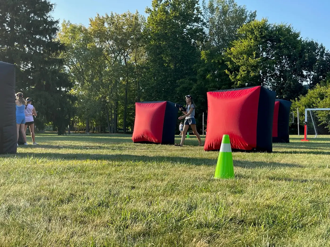 Inflatable Vortex laser tag bunkers set up outdoors for a corporate or community event