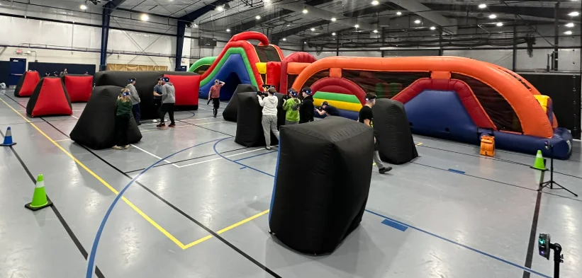 Elevated view of the full laser tag battlefield and bunker layout during a middle school fundraiser